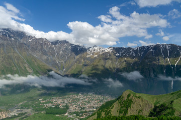 Fototapeta na wymiar Panoramic beautiful view of the Stepantsminda village in the mountains