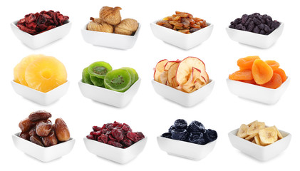 Bowls with different dried fruits on white background