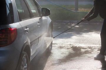 Manual car washing with high pressured water