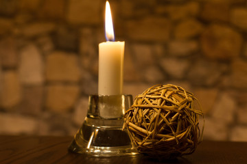 candle on table with wodden decoration