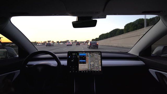 Interior view of an autonomous car or electric vehicle in full self driving autopilot mode showing the advanced innovation of EV