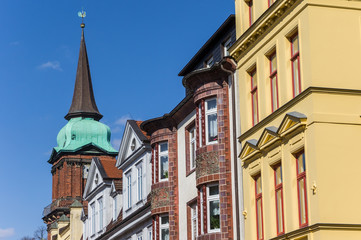 Fototapeta na wymiar Colorful houses and church tower in Schwerin, Germany