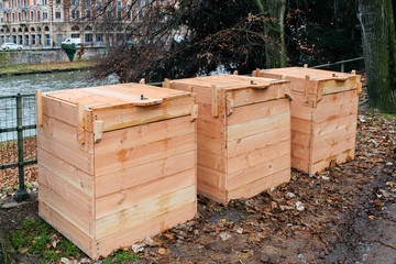 Three new compost wooden boxes with locks in central part of a French city recycling of organic...