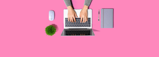 Person using a laptop computer from above