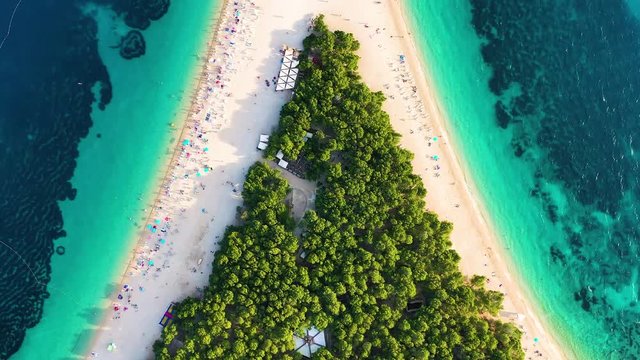 Croatia, Hvar island, Bol. Aerial view at the Zlatni Rat. Beach and sea from air. Famous place in Croatia. Summer seascape from drone. Travel - video