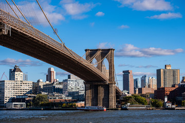 Brooklyn Bridge in daylight view from Lower East Side waterfront