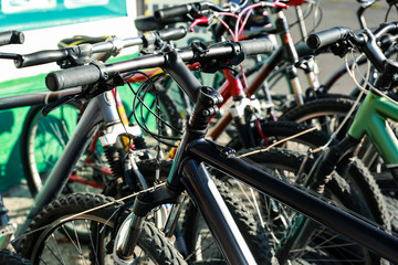Fototapeta na wymiar Many modern bicycles parked outdoors