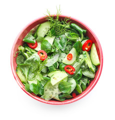 Bowl with fresh vegetable salad on white background
