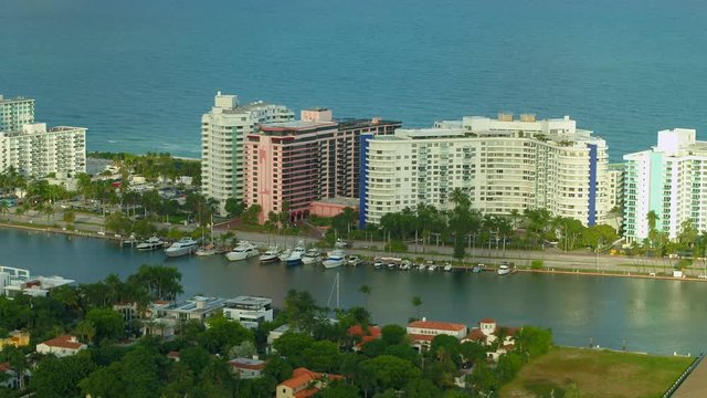 Yachts and Miami Beach Condominium buildings aerial stock drone footage