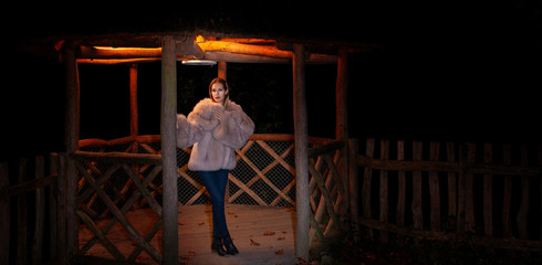 femal model outin nature with fur coat
