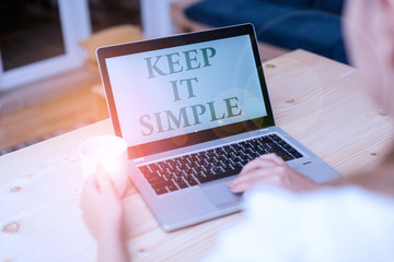 Handwriting text writing Keep It Simple. Conceptual photo to make something easy to understand and not in fancy way woman laptop computer smartphone mug office supplies technological devices