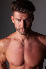 Obraz premium The portrait of muscular handsome model without t-shirt.