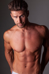 Fototapeta premium The portrait of muscular handsome model without t-shirt.