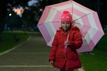latin girl umbrella in the park