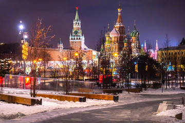 Obraz premium Moscow at Christmas. Festive evening in the capital of Russia. The streets of Moscow are decorated for the New year. Kremlin. Red square. St. Basil's Cathedral. Christmas trip to Russia.