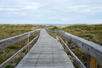 Fototapeta na wymiar Wooden path to Tybee Island Beach near Savannah, Georgia in oktober.