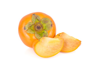 whole and sliced fresh ripe persimmon on white background