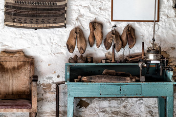 Vintage shoemaker workshop with shoes molds