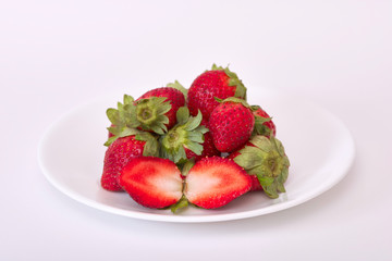 Ripe whole and sliced strawberries