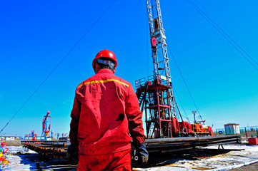 Oil field oil workers at work