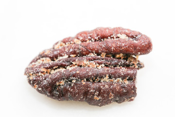 Sugar preserved pecans on a white, isolated. - Image