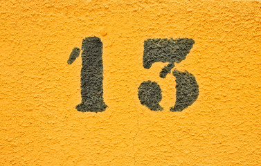 13, number thirteen, black digits on graduated orange / saturated yellow background.