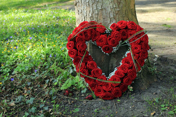 Sympathy flowers near a tree