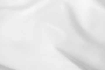 Obraz premium Abstract white fabric texture background. Cloth soft wave. Creases of satin, silk, and cotton.