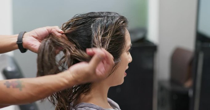 Woman having hair treatment in hair salon