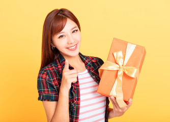 Happy young asian woman  holding gift box