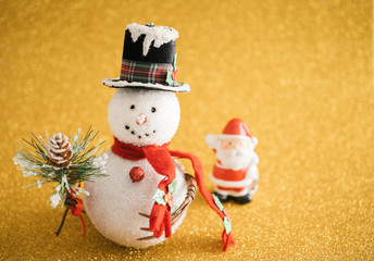 Christmas decoration snowman on gold glitter background