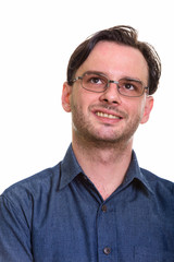 Obraz premium Face of formal young happy man smiling while thinking