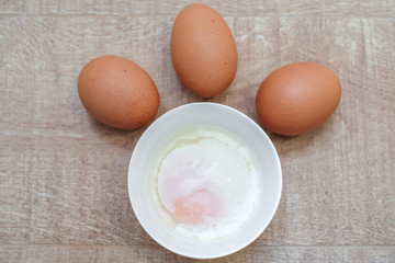 Soft boiled egg for breakfast on wooden table, Japanese onsen egg