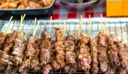 Fried meat with sticks, street food market Vietnam