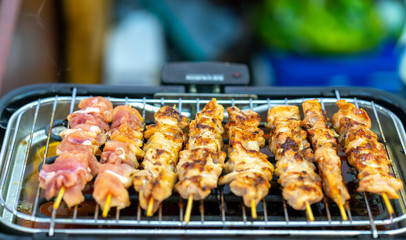 Fried meat with sticks, street food market Vietnam