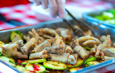 Pickled chicken feet mango premature, Vietnamese street food