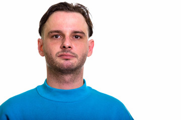 Obraz premium Face of man wearing blue sweater looking at camera