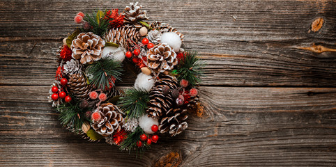 New Year's wreath of spruce and Christmas decorations