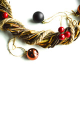 Christmas wreath with holly berries against white background
