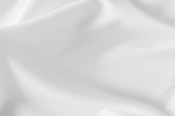 Abstract white fabric texture background. Cloth soft wave. Creases of satin, silk, and cotton.