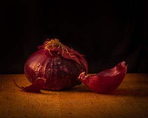 Still Life of a Red Onion on a Cutting Board 