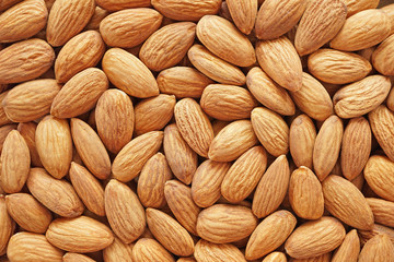   Raw peeled almond seeds background,almond nut is unsaturated fat food benefit for decrease blood cholesterol and good nutrition for diet and lost weight.