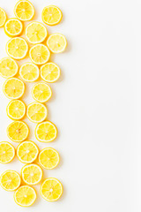 Lemon frame. Sliced citruses on white background top view copy space