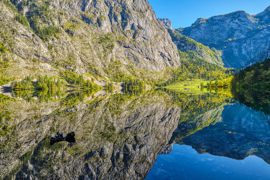 The lovely Obersee in the Bavarian Alps with a reflection of the mountains in the water