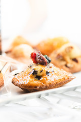 Madeleine with blueberry and raspberry