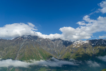 Fototapeta na wymiar Picturesque view of Mount Kazbek in the Caucasian mountains. Caucasus