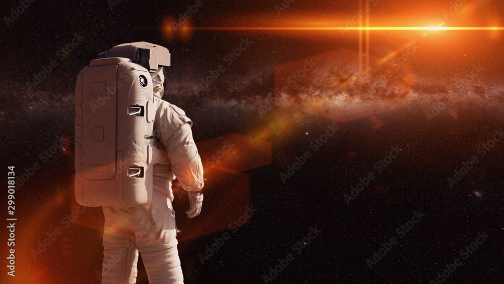 Wall mural standing astronaut looking into empty space
