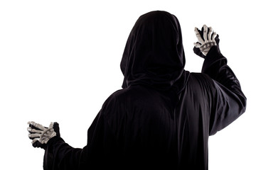 The grim reaper or death halloween costume isolated on a white background.  The skeleton is wearing...