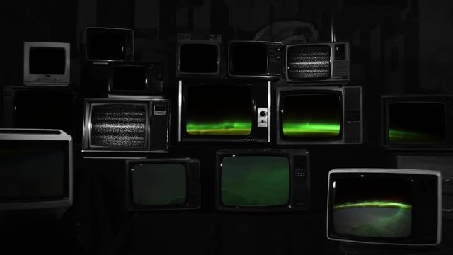 Planet Earth from the International Space Station on Retro TVs. Black and White Tone. Zoom In. Elements of this video furnished by NASA. 