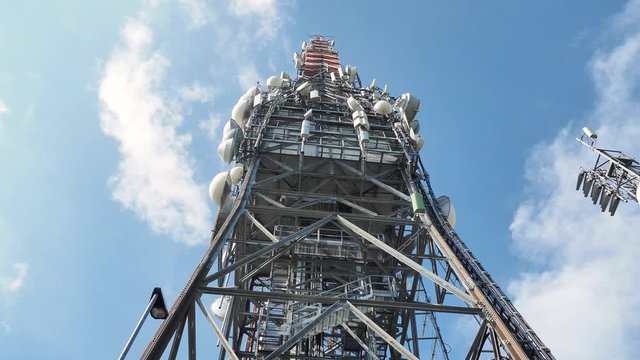 Tower for telecommunications, television broadcast, cellphone, radio and satellite on Linzone mountain peak. Telecommunication center. Electromagnetic and environmental pollution. Italian Alps. Italy